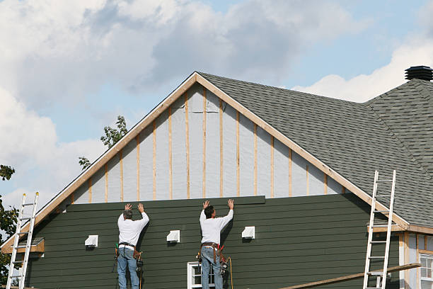 Professional Storm Damage Siding Repair technician working in Medina, MN